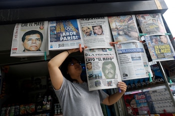 FILE PHOTO: A newspaper seller