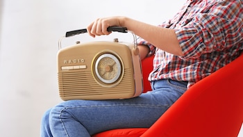 Young woman with retro radio