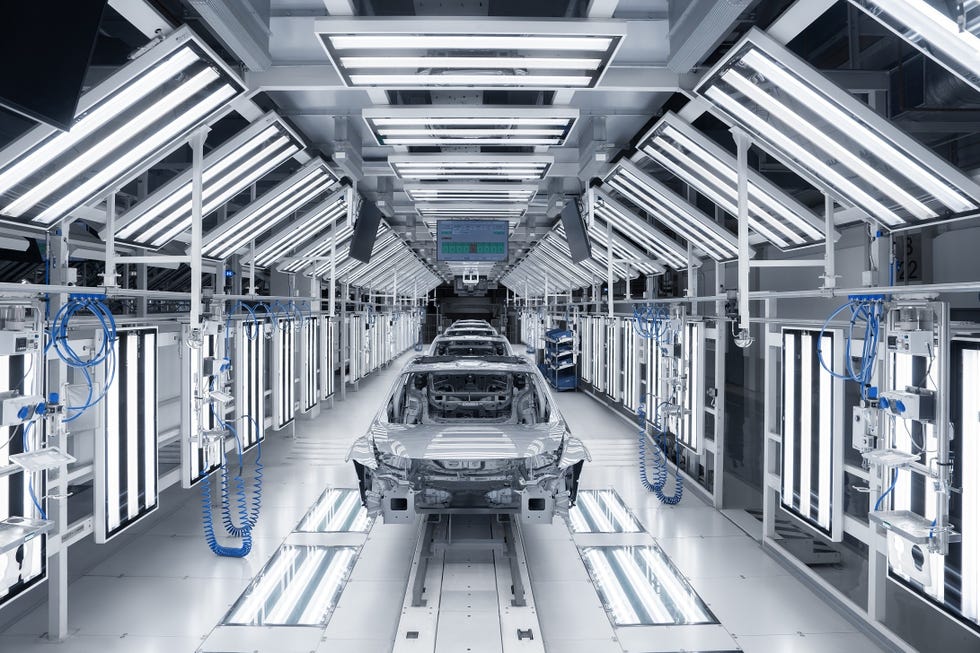 the audi e5 sportback is produced at a dedicated manufacturing facility located on the premises of the saic volkswagen plant in anting, shanghai. pictured: vehicle assembly and surface inspection.