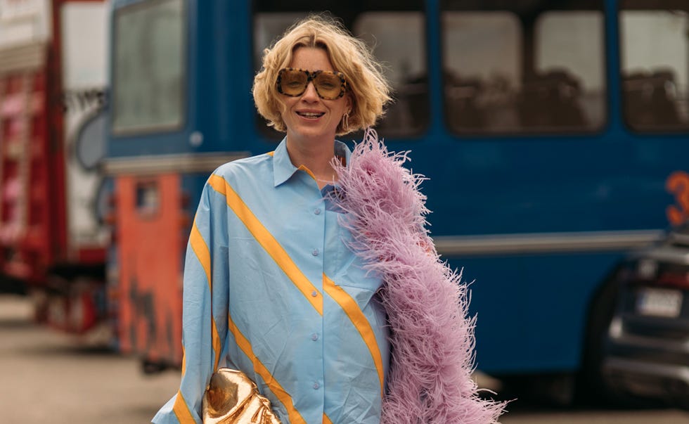 person wearing a colorful outfit with fluffy accessory