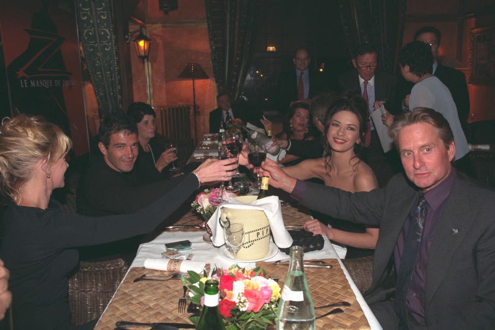 (original caption) melanie griffith, antonio banderas, catherine zeta jones and michael douglas at dinner. (photo by eric robert/sygma/sygma via getty images)