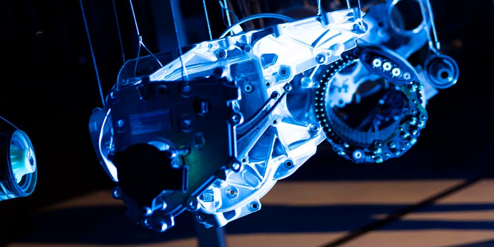 suspended mechanical components illuminated by blue light