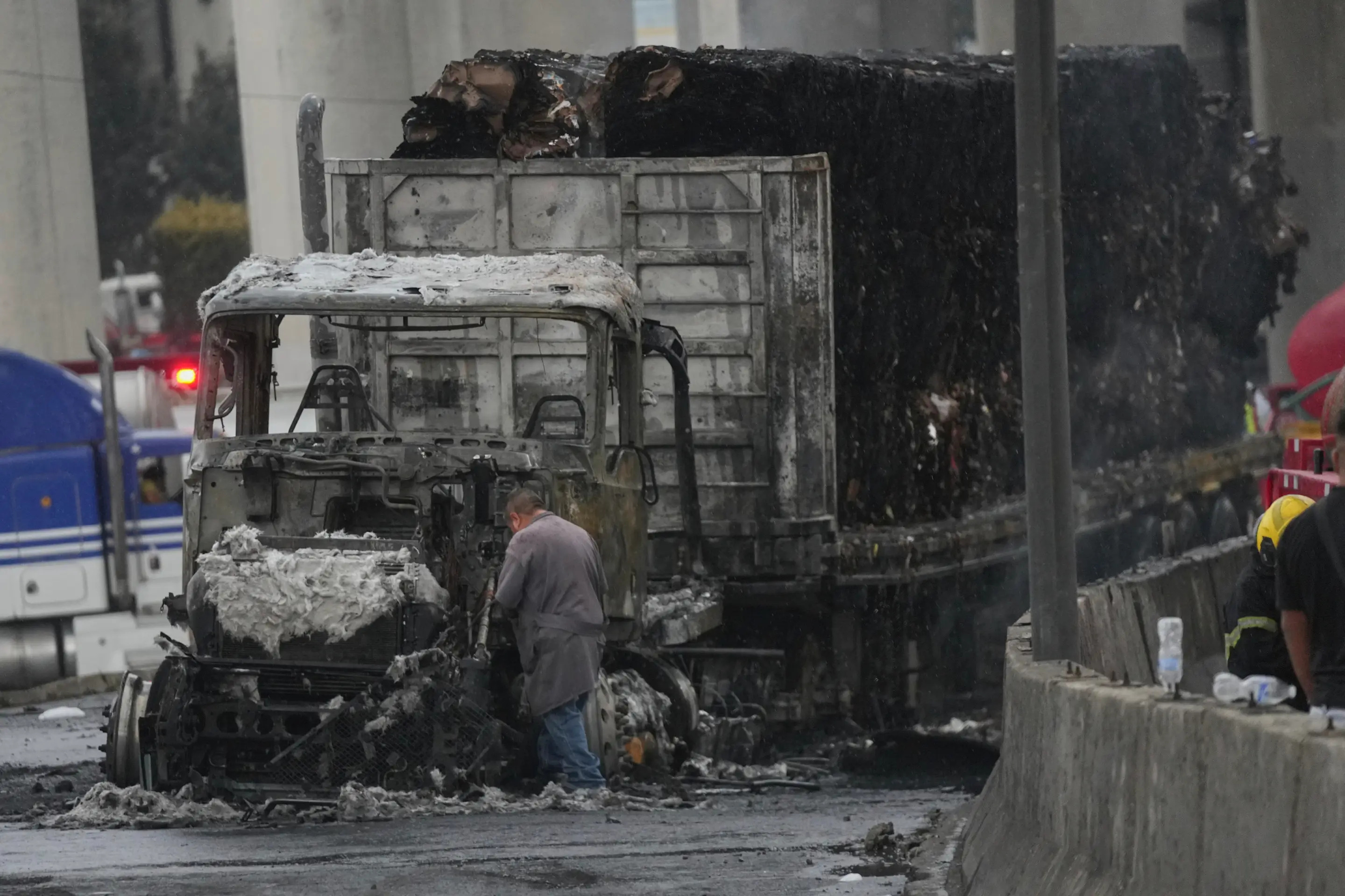 A damaged truck sits on a road following a gas tanker explosion in Mexico City, Wednesday, Sept. 10, 2025. (AP Photo/Fernando Llano)
