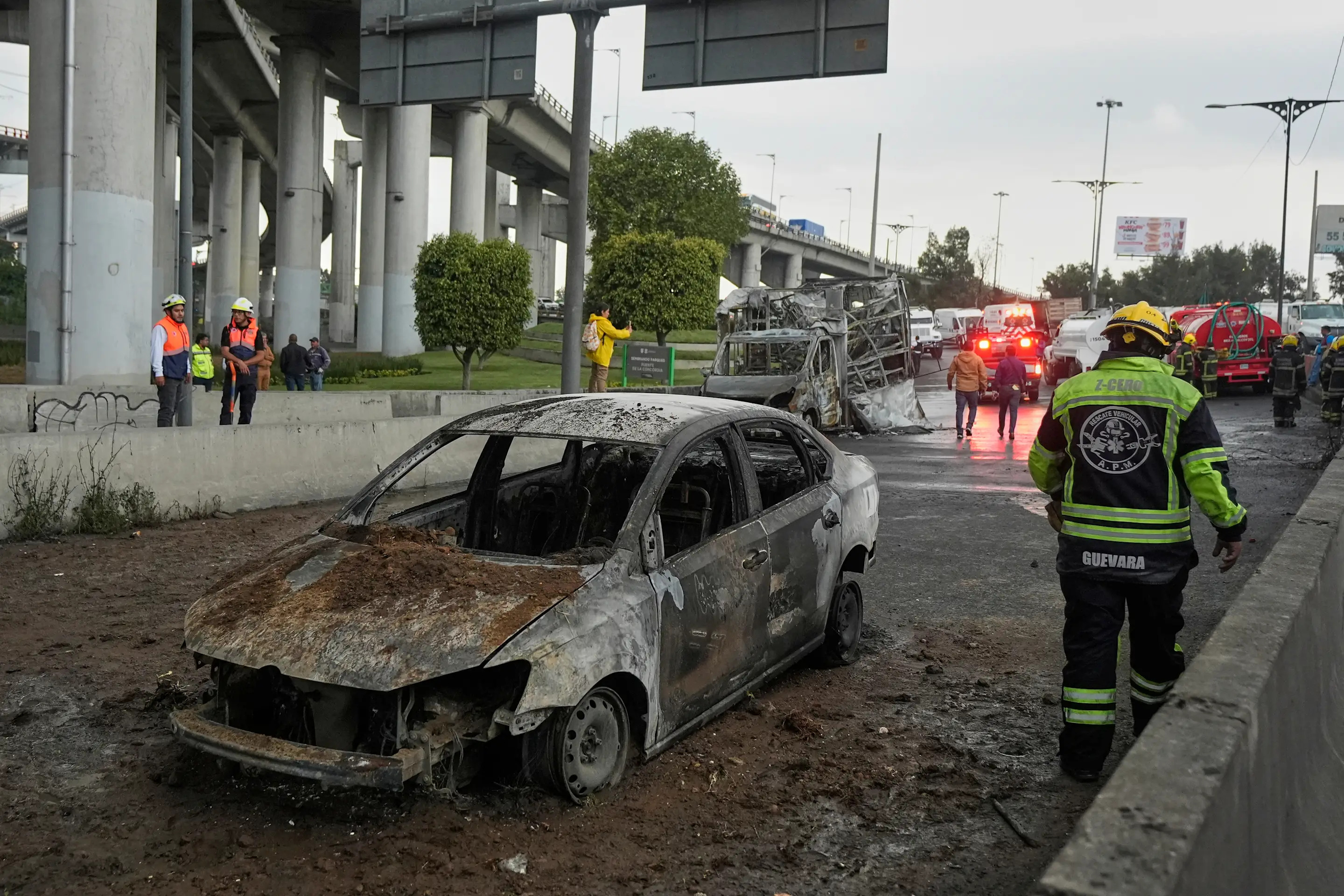 A burned car sits below an underpass following a gas tanker explosion in Mexico City, Wednesday, Sept. 10, 2025. (AP Photo/Fernando Llano)