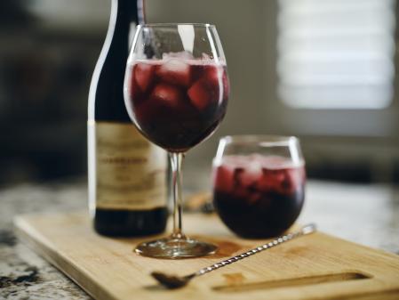 A closeup of a glass of a chilled wine that is served over ice.
