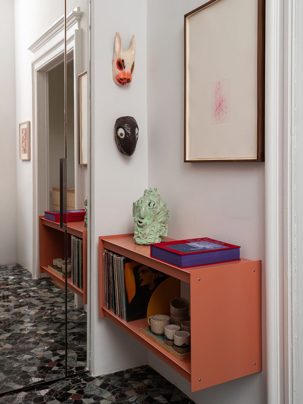 Interior hallway with decorative elements and furniture.