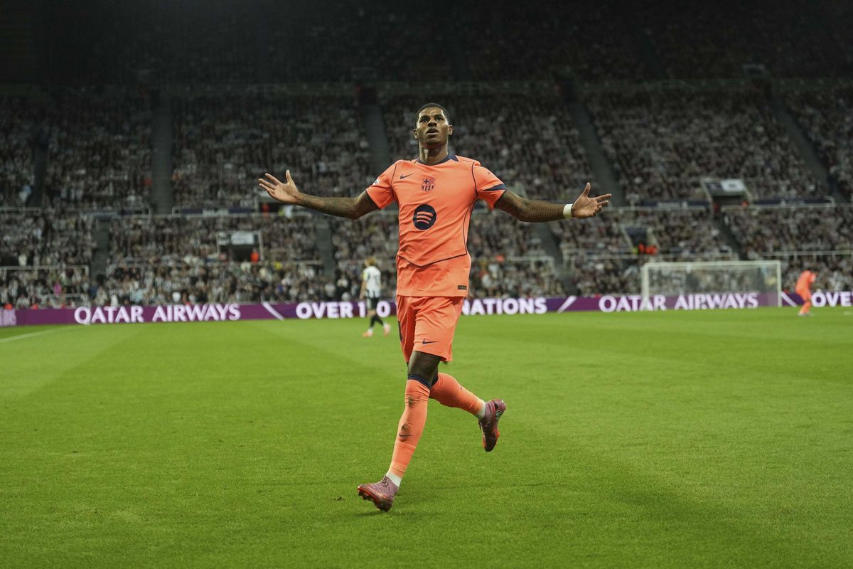 Barcelona's Marcus Rashford celebrates after scoring his side second goal during the Champions League, opening phase soccer match between Newcastle and Barcelona in Newcastle, England, Thursday, Sept. 18, 2025. (AP Photo/Jon Super)