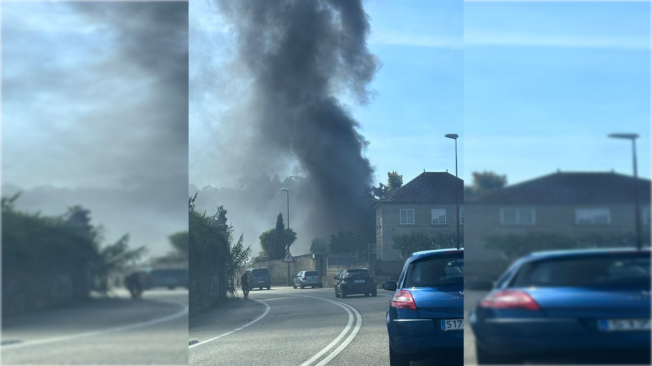 Un incendio en un establo genera una gran columna de humo negro en Vigo