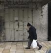 The shuttered Educational Bookshop, is seen after Israeli police raided the long-established Palestinian-owned bookstore in east Jerusalem, detaining its owners and confiscating books about the decades-long conflict saying the books incited violence, Monday, Feb. 10, 2025. (AP Photo/Mahmoud Illean)