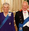 FILE - Britain's Queen Camilla, left, and King Charles III, right, pose for a photo before a State Banquet at Windsor Castle, in Windsor, England, Sept. 17, 2025. (Phil Noble/Pool Photo via AP, file)