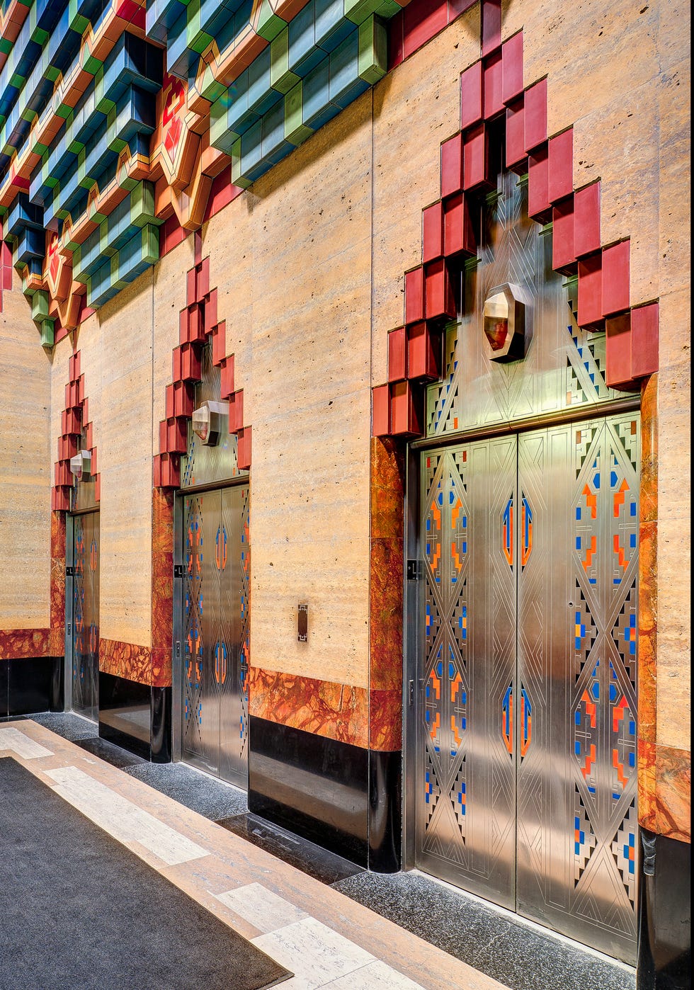 Elevator lobby featuring stylized design elements and distinct color patterns.