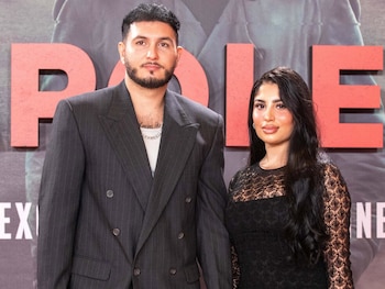 Omar Montes junto a su