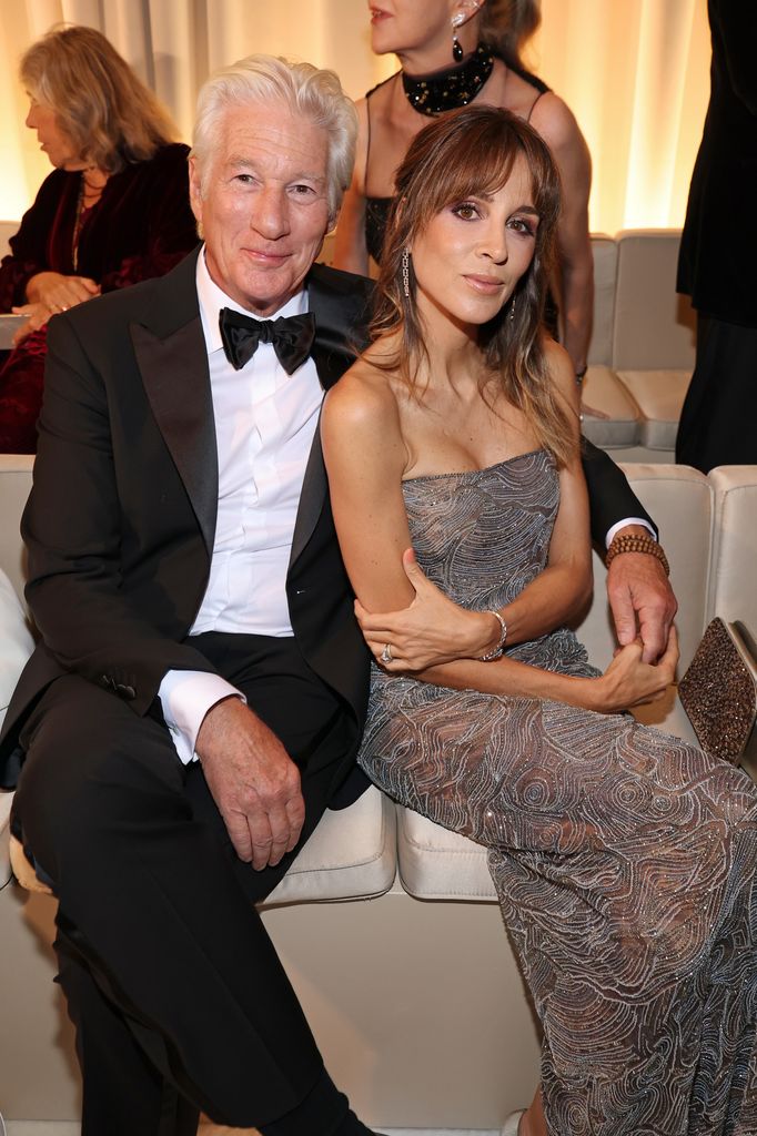 MILAN, ITALY - SEPTEMBER 28: Richard Gere and Alejandra Silva attend the Giorgio Armani fashion show during the Milan Womenswear Spring/Summer 2026 on September 28, 2025 in Milan, Italy. (Photo by Daniele Venturelli/WireImage)