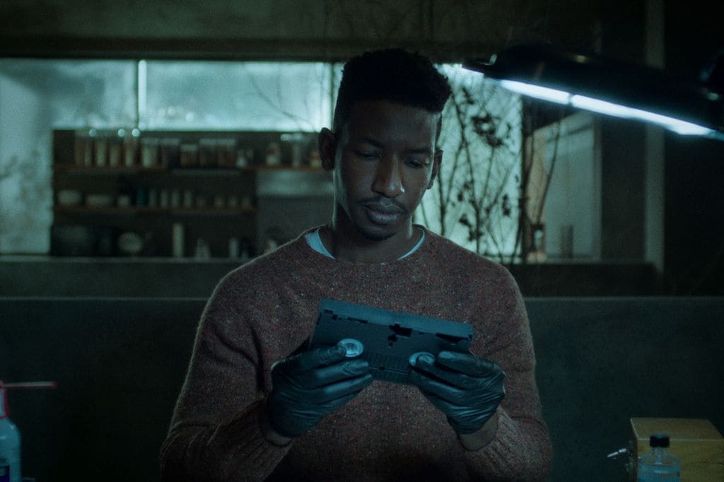 Archive 81. Mamoudou Athie as Dan Turner in episode 106 of Archive 81. Cr. Courtesy Of Netflix Â© 2021