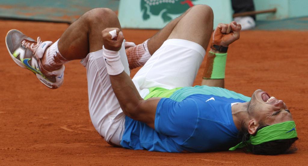 Spain's Rafael Nadal jubilates after defeating Sweden's Robin Soderling during a men's finals match for the French Open tennis tournament at the Roland Garros stadium in Paris, Sunday, June 6, 2010. (AP Photo/Michel Euler)
