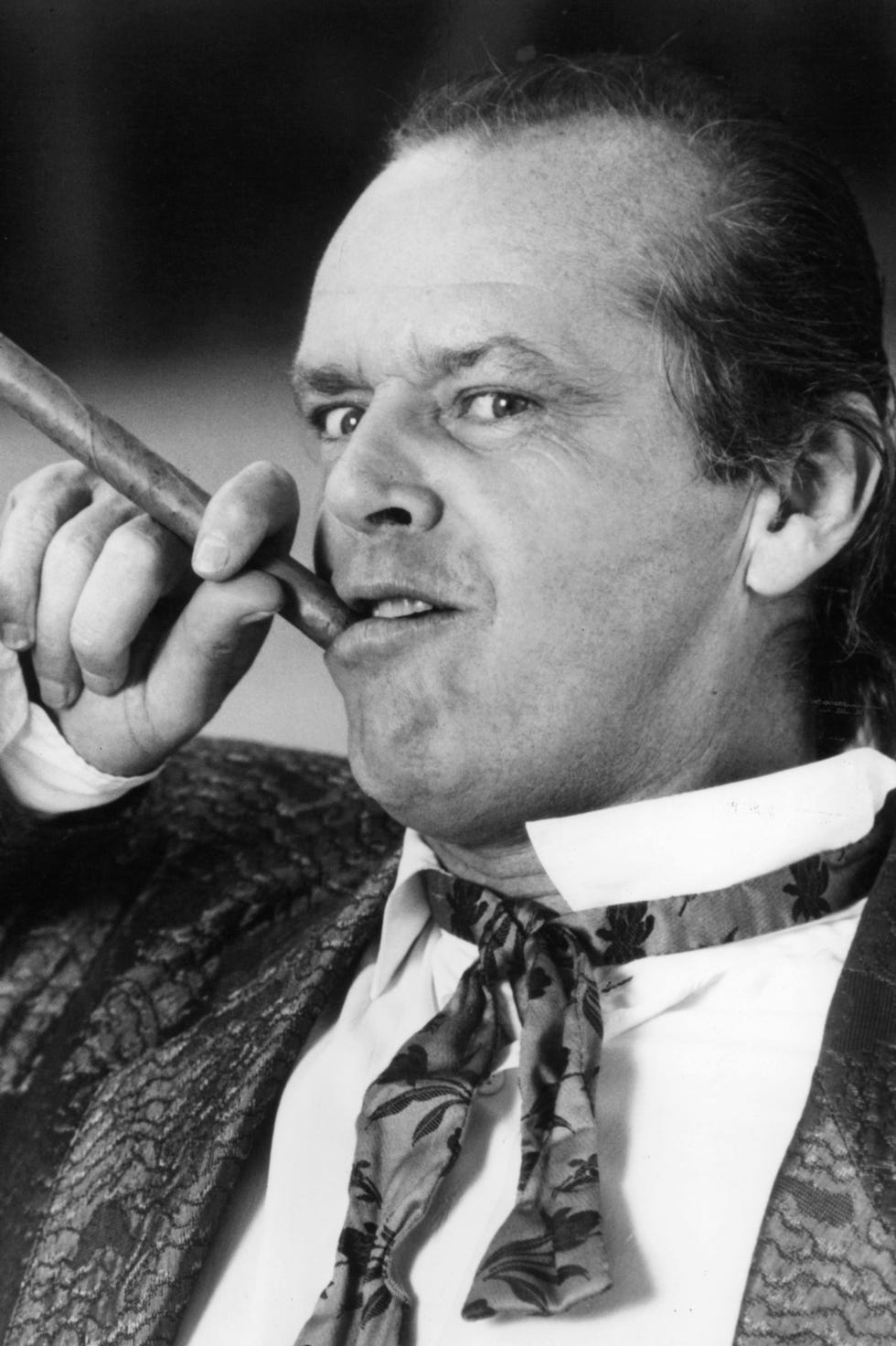jack nicholson holds a cigar to his lip in a scene from the film the witches of eastwick, 1987. (warner brothers/getty images)