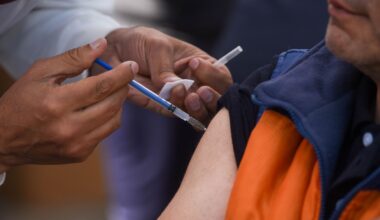 a building with a curved roof and a sky background