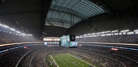 FILE - Fans watch at the start of an NFL football game inside AT&T Stadium between the New York Giants and Dallas Cowboys, Sunday, Sept. 8, 2013, in Arlington, Texas. There are 23 venues bidding to host soccer matches at the 2026 World Cup in the United States, Mexico and Canada. (AP Photo/Tony Gutierrez, File)