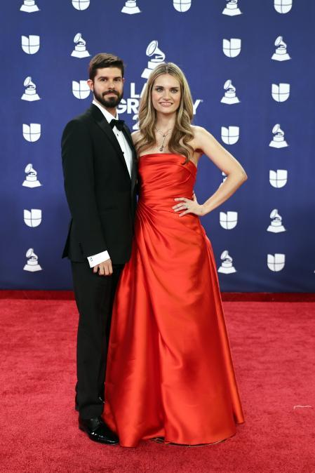 LAS VEGAS, NEVADA - NOVEMBER 13: EDITORIAL USE ONLY. (L-R) Guest and Isabel Dobarro attend the red carpet during the 26th Annual Latin GRAMMY Awards at MGM Grand Garden Arena on November 13, 2025 in Las Vegas, Nevada. (Photo by Omar Vega/FilmMagic)