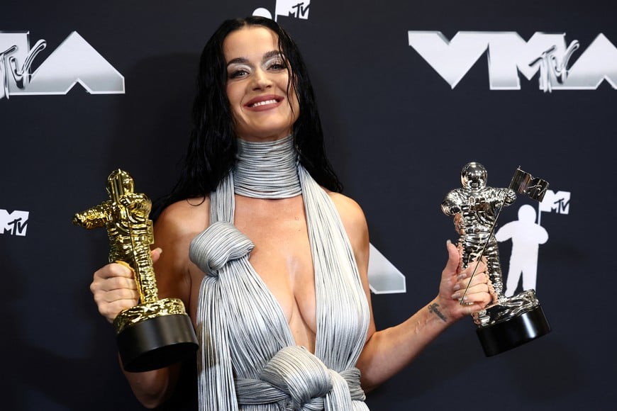 Katy Perry, recipient of the Michael Jackson Video Vanguard Award and winner of the VMAs Most Iconic Performance award for "Roar" poses with her awards at the 2024 MTV Video Music Awards in Elmont, New York, U.S., September 11, 2024.