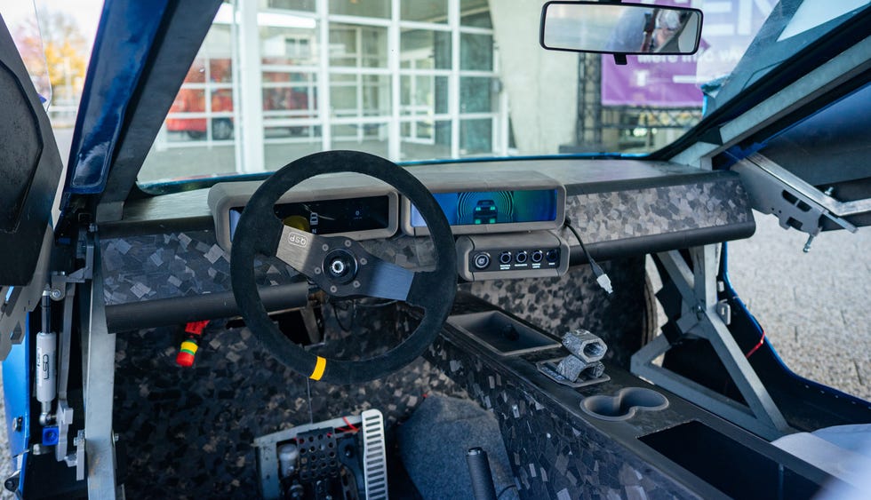 interior of a vehicle showcasing a modern dashboard and steering wheel