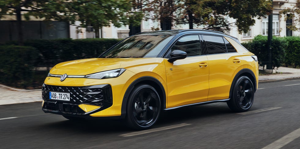 Volkswagen T-Roc 2026 a yellow suv in motion on a city street