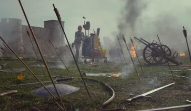 Una persona limpiando un campo de batalla medieval