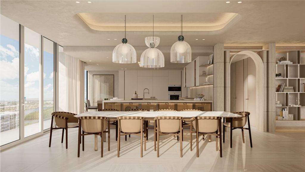 Comedor y cocina en los que predominan las líneas curvas, suaves y agradables