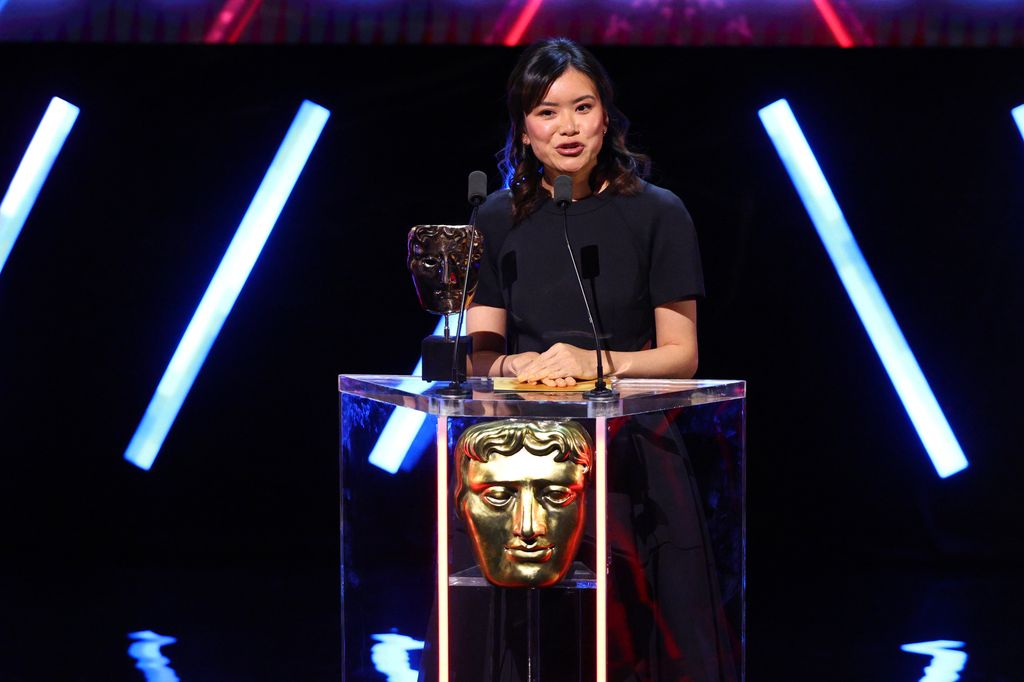 LONDON, ENGLAND - APRIL 08: Katie Leung presents the Performer in a Supporting Role Award on stage during the BAFTA Games Awards 2025 at the Queen Elizabeth Hall on April 08, 2025 in London, England. (Photo by Tim Whitby/BAFTA/Getty Images for BAFTA)