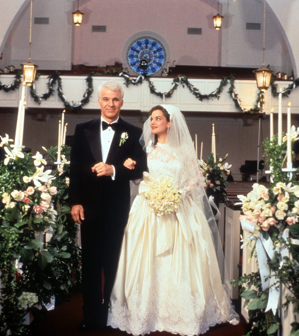 Steve Martin And Kimberly Williams-Paisley In 'Father Of The Bride' steve martin walking down the aisle with kimberly williams paisley in a scene from the film father of the bride, 1991. (photo by touchstone/getty images)