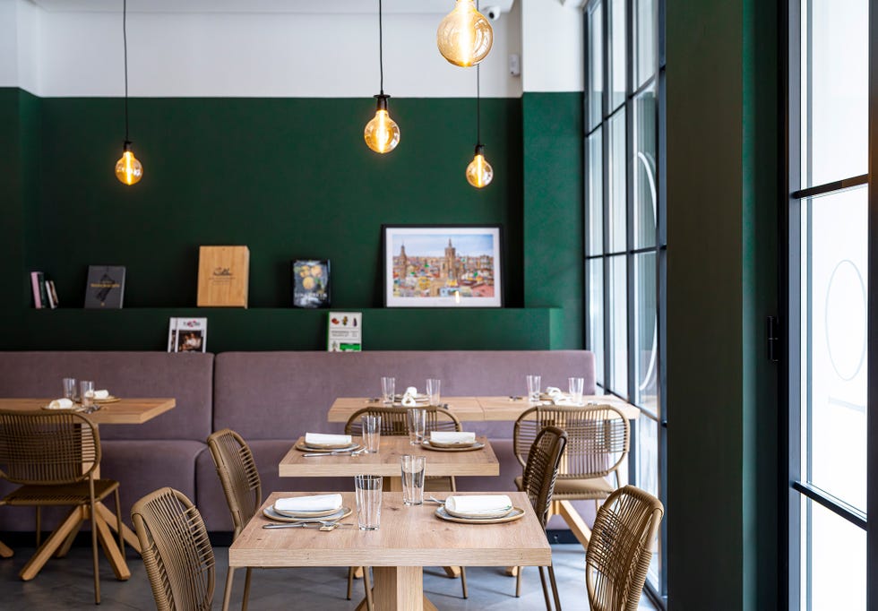 minimalist dining area with wooden tables and modern decor