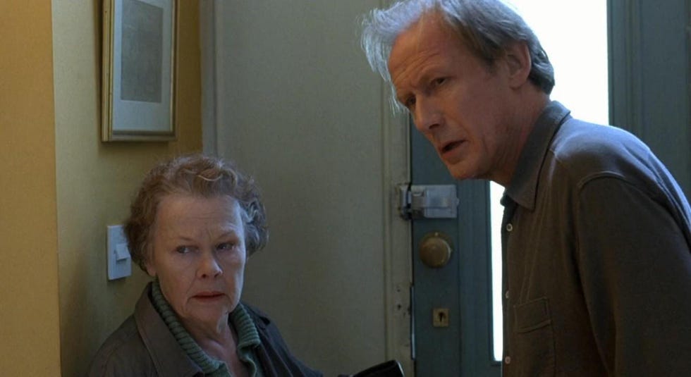 interaction between two individuals at a doorway