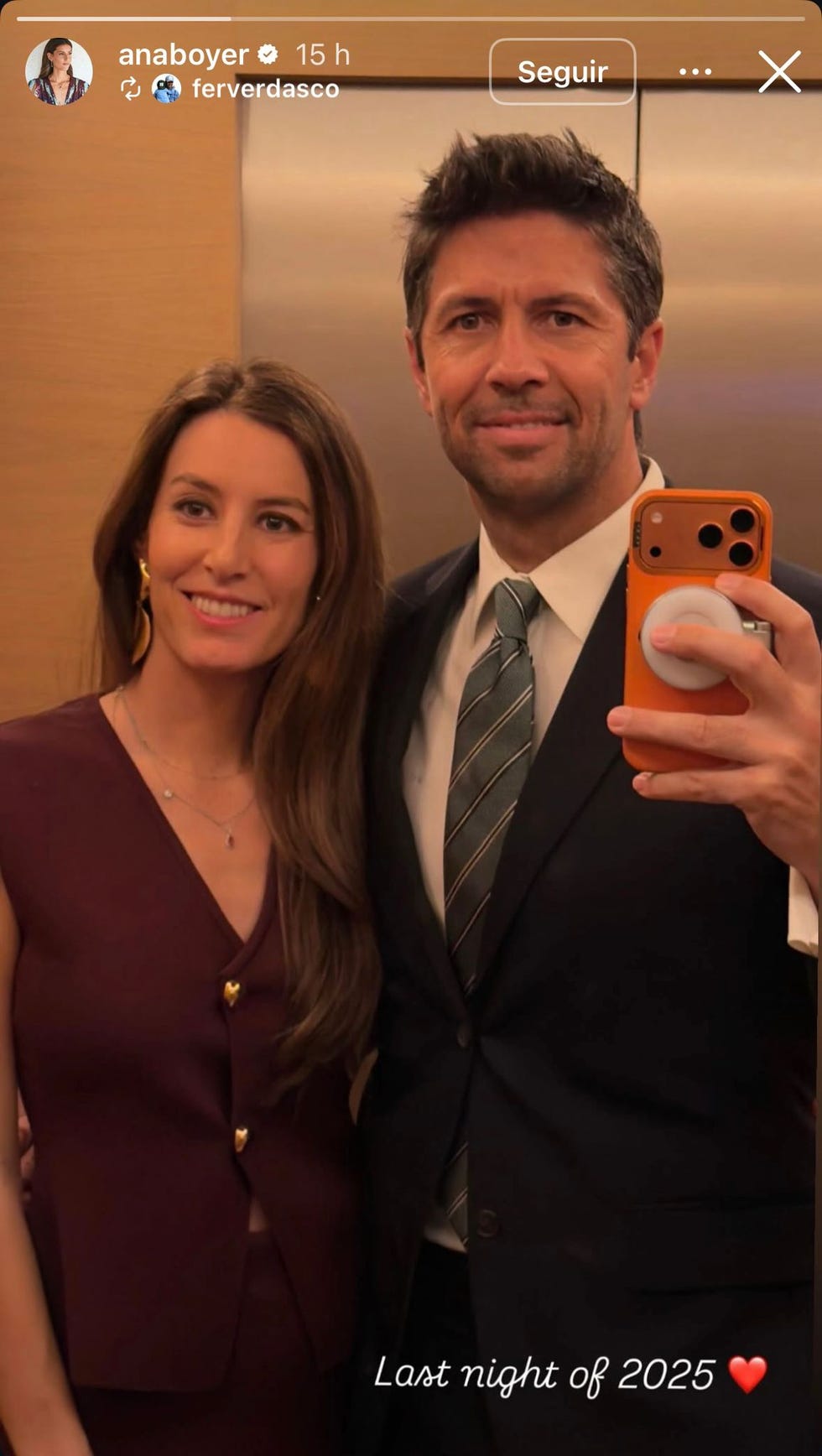 selfie taken in an elevator with two individuals selfie taken in an elevator with two individuals