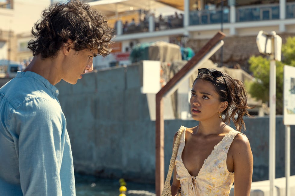 Two people having a serious conversation outdoors.