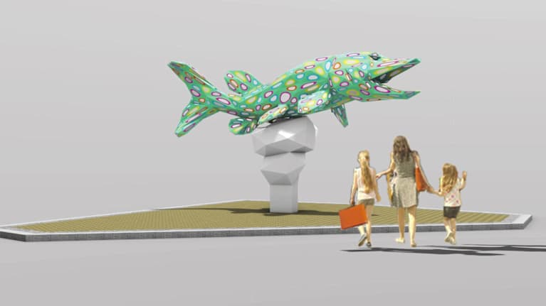 Värikäs veistos valtavasta hauesta. Lapsiperhe lähestyy taideteosta. Havainnekuva.