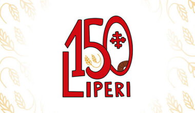 Liperin kunnan juhlavuoden logo ja taustalla tähkäkuosi