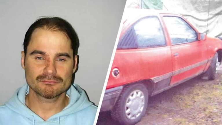 miehen kasvot ja punainen henkilöauto.