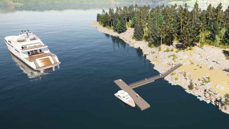 Havainnekuvassa näkyy yläviistosta laituri ja Karhusaaren rantaa yläviistosta. Laiturissa on pieni ja järvellä isompi alus.