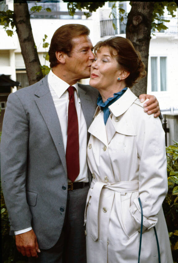 Sir Roger Moore and Lois Maxwell.