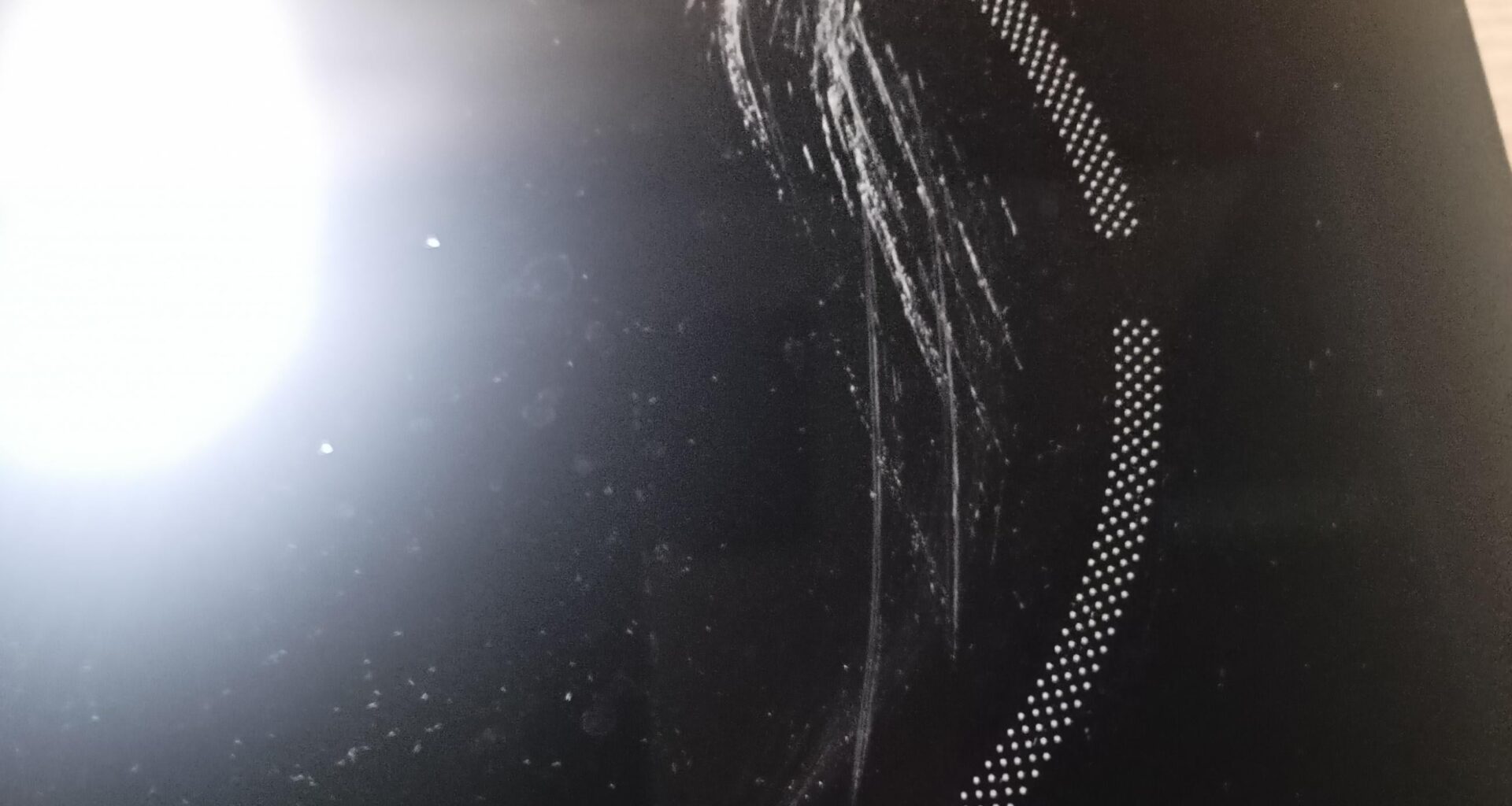 Hi, I need an advice. Microfiber cloth was placed on a hot surface on a glass-ceramic hob, now there is a stain that looks like it was burned. How to clean it?