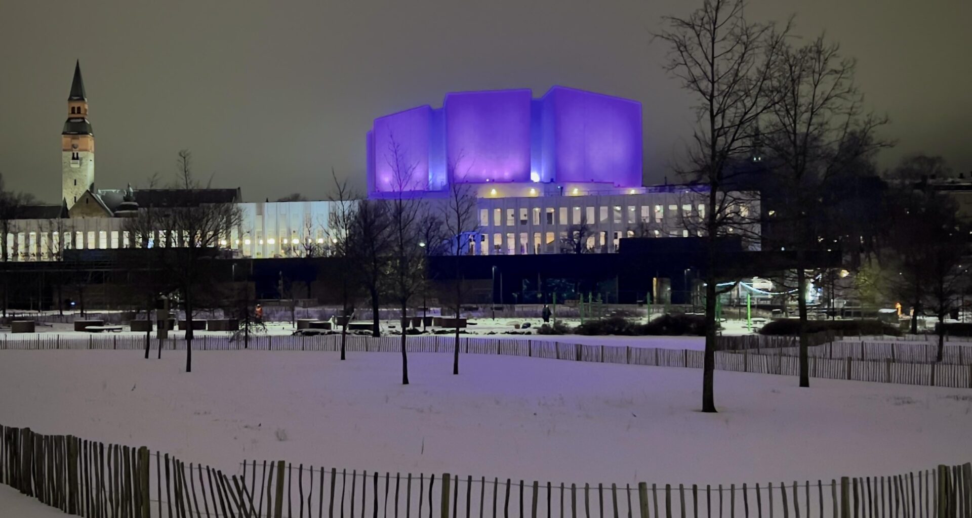 Finlandia Hall with evening lighting (and the tower of National Museum behind.)