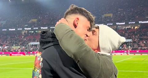 Soccer referee proposes to his boyfriend on the field and crowd cheers wildly as they kiss