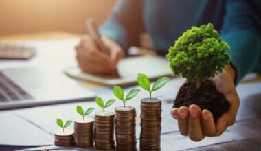 business woman hand holding tree with plant growing on coins. co