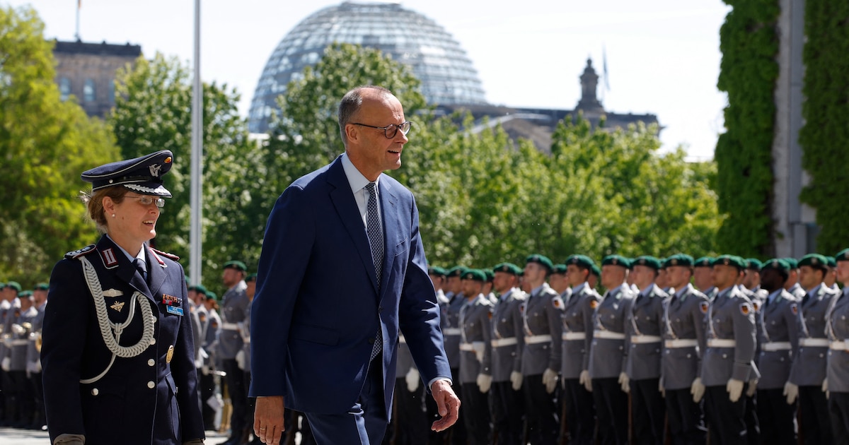 German Chancellor Friedrich Merz greets the military honour guard prior to the arrival of Greece's Prime Minister at the Chancellery in Berlin on May 13, 2025. (Photo by Odd ANDERSEN / AFP)