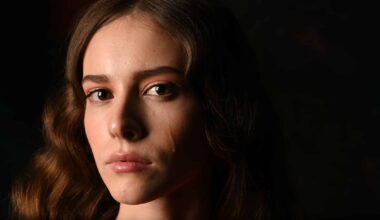 Close Up Portrait Of Woman Crying Against Black Background