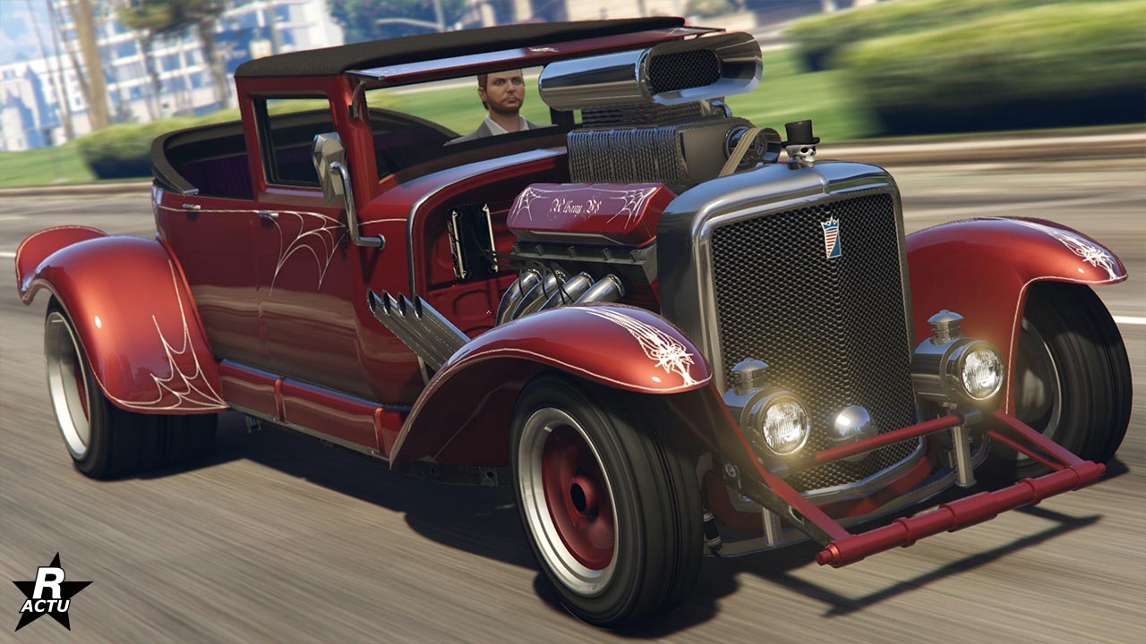 Vue avant du véhicule Albany Fränken Stange dans GTA Online, il s'agit d'un hot road de couleur rouge, la carrosserie dispose d'un motif de décalcomanie de toile d'araignée.
