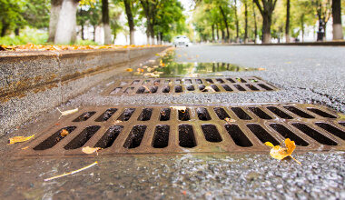 Rain water flows down the hatch cover on a sunny autumn day