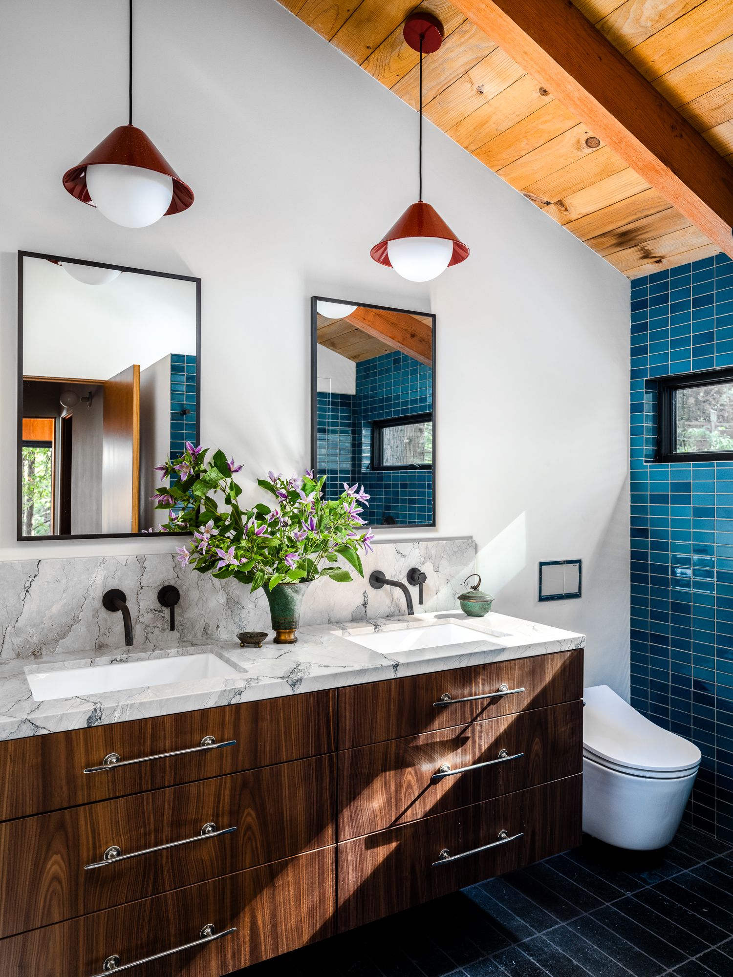 Image may contain Indoors Interior Design Sink Bathroom Room Toilet Hardwood Stained Wood Wood and Sink Faucet