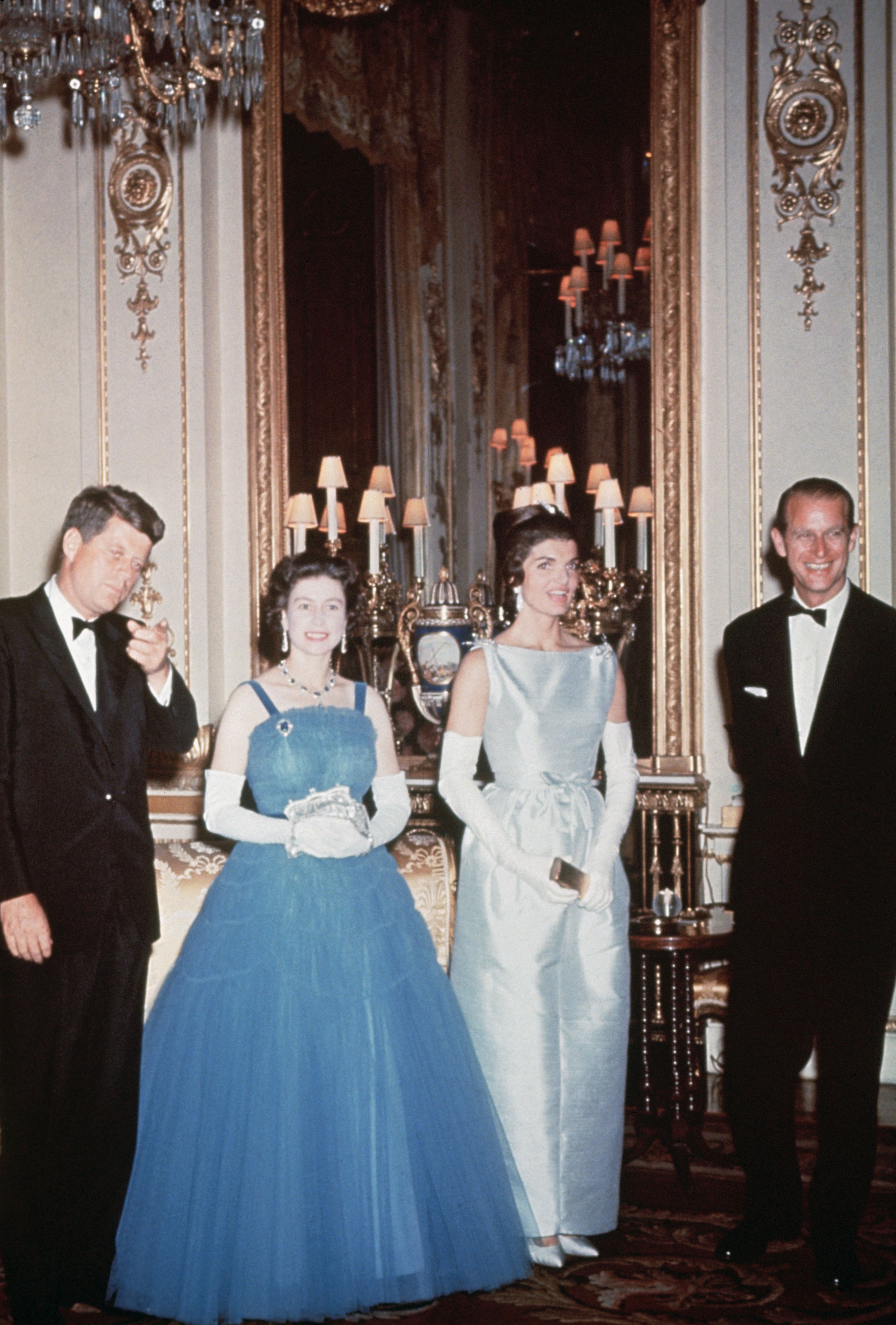 President John F. Kennedy and First Lady Jackie Kennedy pay a visit to the royal family in England. John F. Kennedy...