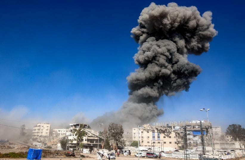  A smoke plume billows during an Israeli strike on an industrial area in Gaza City on July 12, 2026. Gaza's civil defence and hospitals said an Israeli drone strike and gunfire killed five people and injured several others on July 12. 